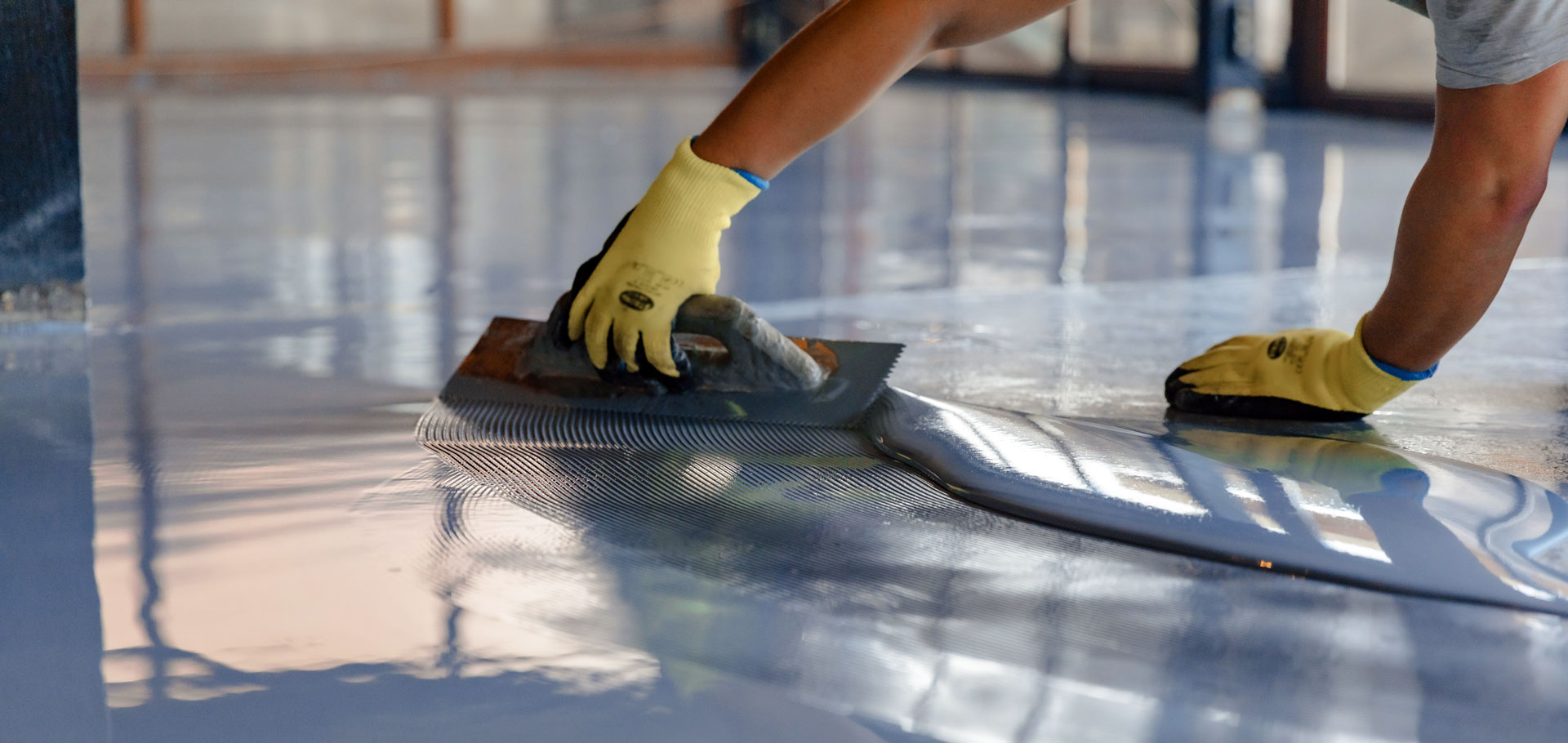 applying an apoxy resin to a floor